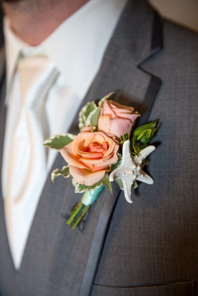 boutonniere on groomsman for wedding with seashell accent knoxville nashville wedding photographer